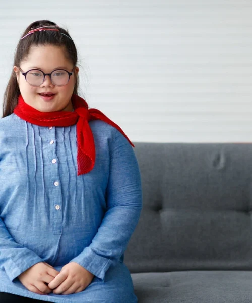 Disabled girl looking at camera and smiling